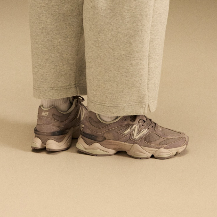 Side profile on-figure shot of the tan and beige shoes. 